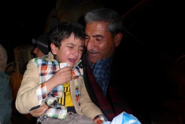 Ayman cries as he meets his cousin at a checkpoint at the Kurdish border, after he was returned to his Yazidi family, January 28, 2017. PHOTO: REUTERS