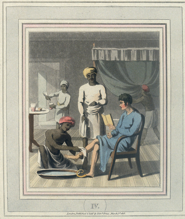 “An Indian servant washes the feet of his European master.”