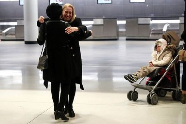 Alma Kashkooli, (12), from Iran who has a severe medical condition, is wheeled out of customs by her mother Farimeh Kashkooli who is living in the United States on a student Visa while studying at Fordham University Law School in New York, as Alma arrives at New York's John F Kennedy International Airport in New York after traveling from Istanbul Turkey February 6, 2017. PHOTO: REUTERS