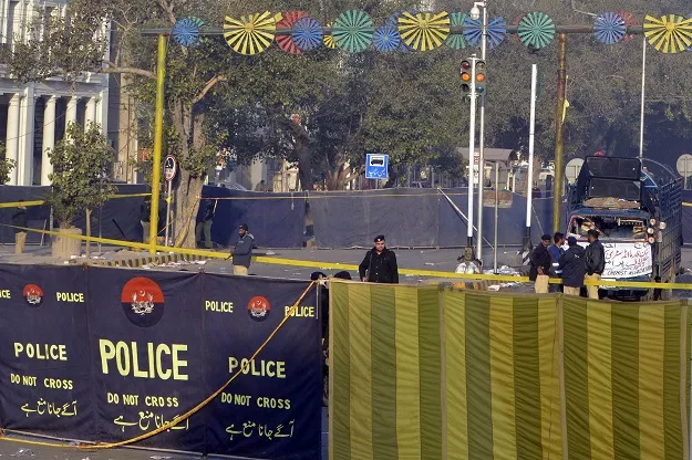 security officials inspect the site of a suicide bombing in lahore on february 14 2017 photo afp security officials inspect the site of a suicide bombing in lahore on february 14 2017 photo afp