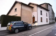 french police gather outside the house where the bodies of two infants have been discovered in a freezer in ailleviller et lyaumont eastern france on feb 12 2026 photo afp