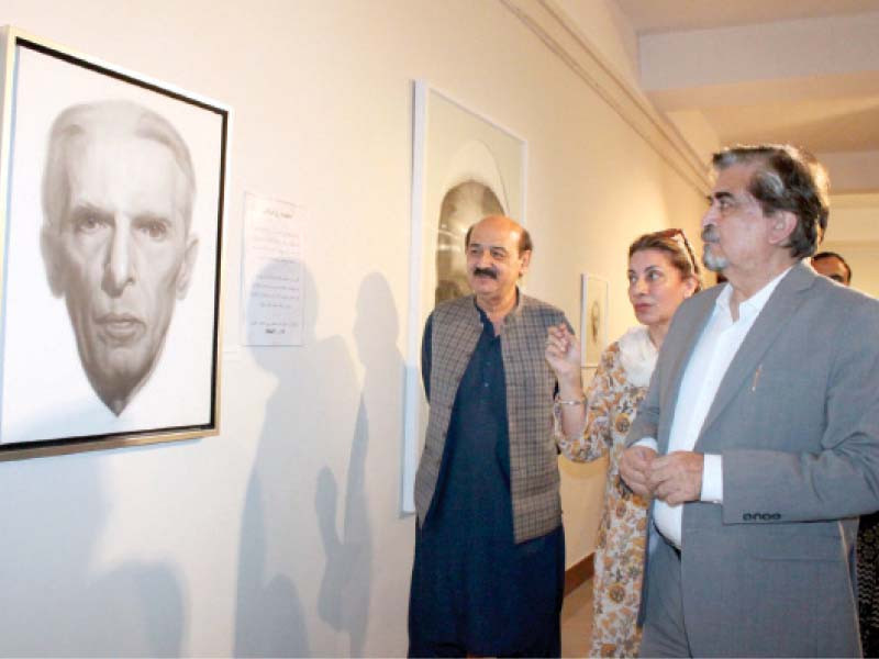 jamal shah admires intricately crafted portraits of the quaid i azam at an exhibition organised at the national arts gallery in pnca islamabad photo express