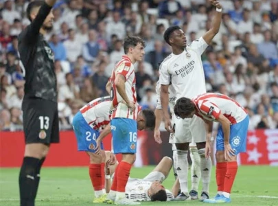 madrid title hopes dented by girona