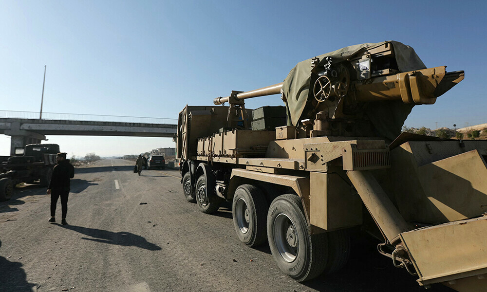 a syrian army truck mounted field gun is left behind on a highway in morek leading to the hama province in central west syria on december 1 2024 photo afp