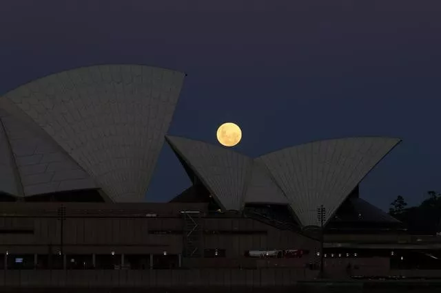 a super flower moon rises behind the sydney opera house on the night of a lunar eclipse in sydney australia may 26 2021 photo reuters a super flower moon rises behind the sydney opera house on the night of a lunar eclipse in sydney australia may 26 2021 photo reuters