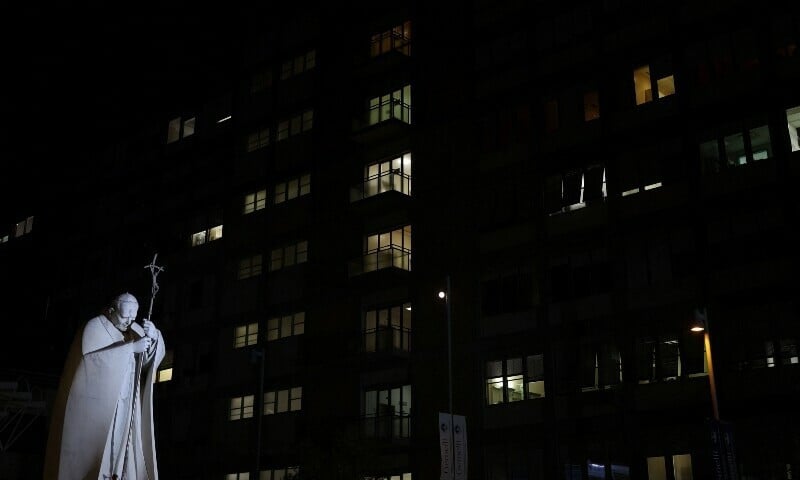 the statue of late pope john paul ii stands outside gemelli hospital where pope francis is admitted for treatment in rome on sunday march 2 2025 photo reuters