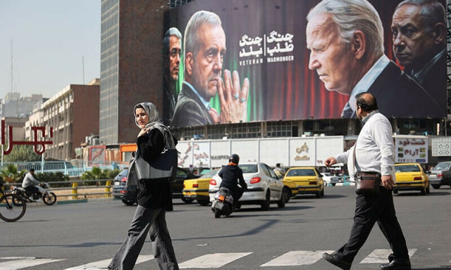 iranians walk next to an anti us and israeli billboard with pictures of iranian president masoud pezeshkian and iranian armed forces chief of staff major general mohammad bagheri and u s president joe biden and israel s prime minister benjamin netanyahu on a street in tehran iran photo reuters iranians walk next to an anti us and israeli billboard with pictures of iranian president masoud pezeshkian and iranian armed forces chief of staff major general mohammad bagheri and u s president joe biden and israel s prime minister benjamin netanyahu on a street in tehran iran photo reuters
