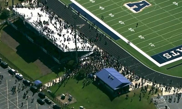 students and staff gather next to the football field after law enforcement officers responded to a fatal shooting at apalachee high school in a still image from aerial video in winder georgia on september 4 photo reuters students and staff gather next to the football field after law enforcement officers responded to a fatal shooting at apalachee high school in a still image from aerial video in winder georgia on september 4 photo reuters