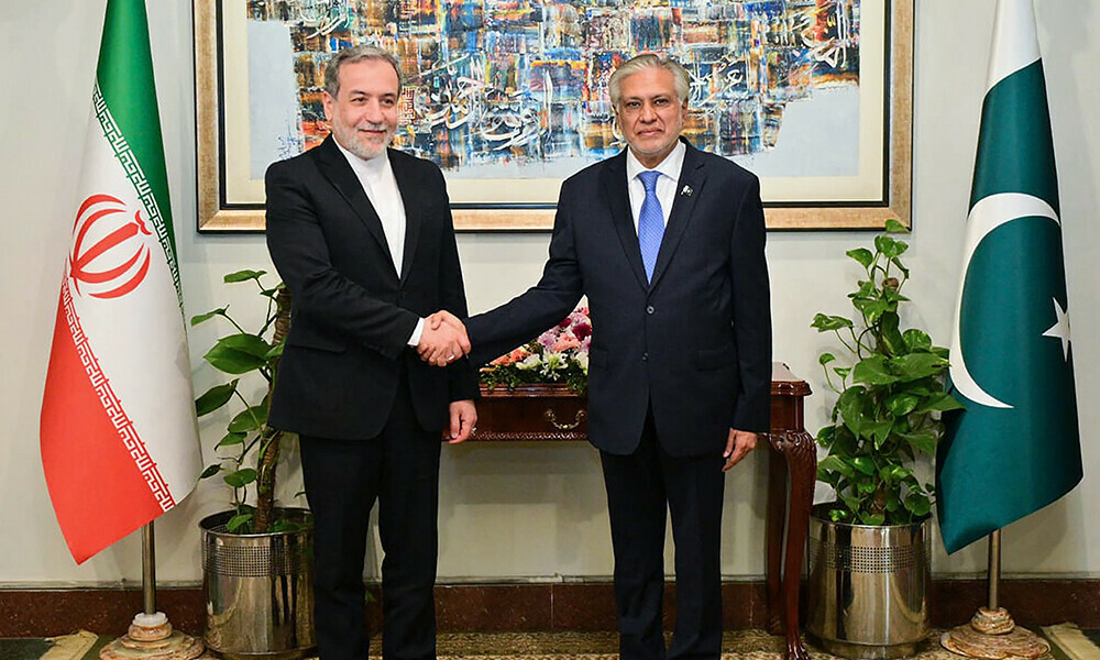 foreign minister ishaq dar r shaking hands with his iranian counterpart abbas araghchi upon his arrival at the foreign ministry in islamabad photo afp