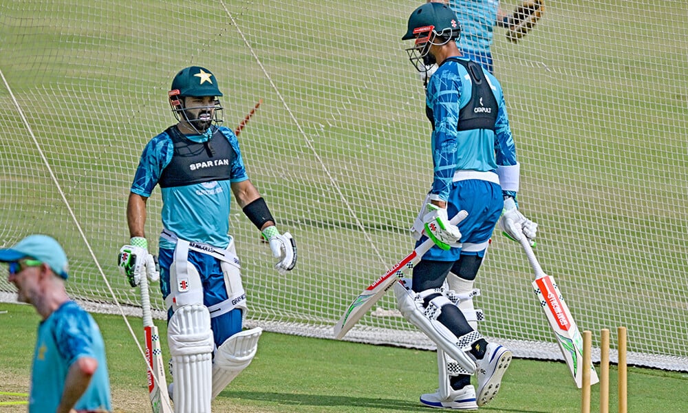 pakistan s mohammad rizwan c and captain shan masood r attend a practice session ahead of their first test cricket match against england at the multan cricket stadium in multan on october 5 2024 photo afp