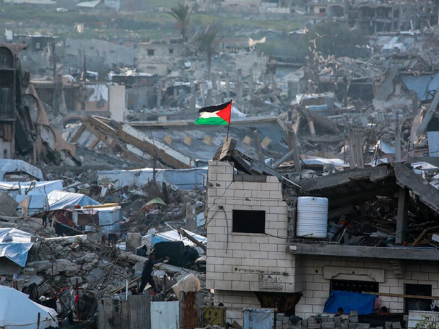 a palestinian flag flutters amid the ruins of buildings in beit lahia in northern gaza on march 4 2025 photo afp a palestinian flag flutters amid the ruins of buildings in beit lahia in northern gaza on march 4 2025 photo afp