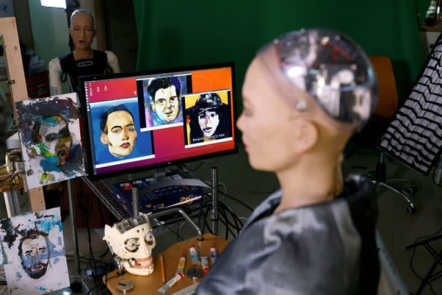 sophia the humanoid robot developed by hanson robotics looks at paintings at her studio before auctioning her own non fungible token nft artwork in hong kong china march 16 2021 photo reuters sophia the humanoid robot developed by hanson robotics looks at paintings at her studio before auctioning her own non fungible token nft artwork in hong kong china march 16 2021 photo reuters