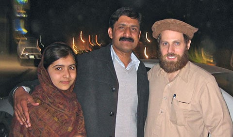 The author, right, with Malala Yousafzai and her father, Ziauddin.