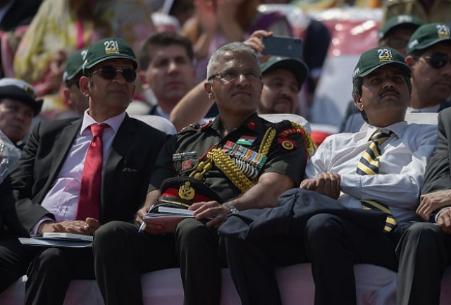 an indian delegation including indian army officer sanjay vishwasrao c watch the pakistan day military parade in islamabad on march 23 2018 photo reuters an indian delegation including indian army officer sanjay vishwasrao c watch the pakistan day military parade in islamabad on march 23 2018 photo reuters