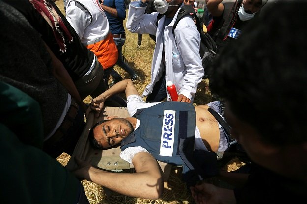 mortally wounded palestinian journalist yasser murtaja 31 is evacuated after getting shot by idf sniper in the southern gaza strip photo reuters