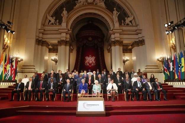 Commonwealth leaders pose for a family photograph with Britain's Queen Elizabeth II at the formal opening of the Commonwealth Heads of Government Meeting (CHOGM) at Buckingham Palace in London on April 19, 2018. The countries represented have been identified as: (back row, L-R) Barbados, Belize, St Vincent and The Grenadines, Malaysia, Tanzania, Zambia, Sierra Leone, Botswana, South Africa, Solomon Islands, Pakistan, The Bahamas, Mauritius, The Gambia. (second row from back, L-R) Ghana, Seychelles, St Lucia, Kiribati, Vanuatu, Jamaica, Canada, Australia, Trinidad and Tobago, Guyana, Lesotho, Namibia, St Kitts and Nevis, Mozambique. (second row from front row, L-R) Sri Lanka, Tonga, Fiji, Antigua and Barbuda, Malawi, India, Nigeria, Tuvalu, Nauru, Kenya, Cyprus, PNG, Cameroon, Bangladesh, New Zealand. (front row, L-R) Swaziland, Singapore, Dominica, Grenada, Malta, United Kingdom, Britain's Queen Elizabeth II, Commonwealth Secretary. PHOTO: AFP