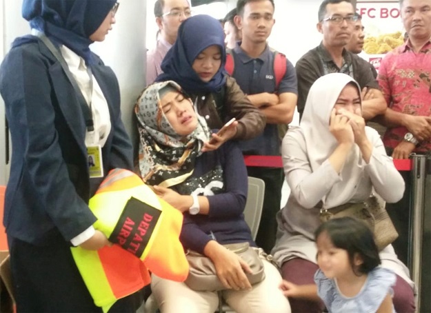 Relatives of passengers of Lion Air flight JT610 that crashed into the sea, cry at Depati Amir airport in Pangkal Pinang, Indonesia. PHOTO: REUTERS