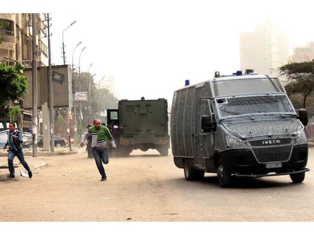 egyptian police vehicles at a demonstration in cairo photo afp