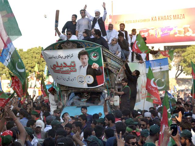 pti chief imran khan and ji chief sirajul haq leading an election rally in karachi photo inp