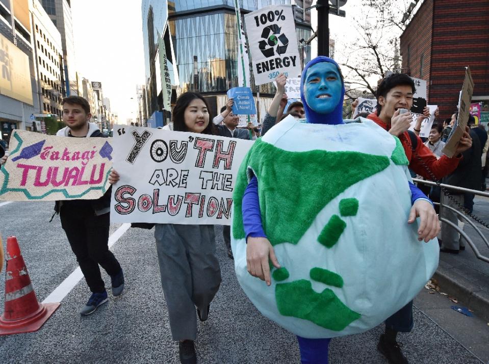 people march in earth parade 2015 in tokyo on november 28 2015 photo afp