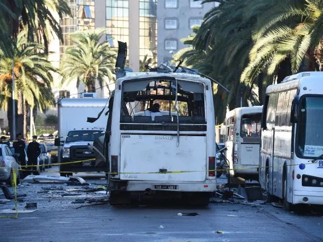 tunisian forensic police inspect the wreckage of a bus in the aftermath of a bomb attack on the vehicle which was transporting tunisia 039 s presidential guard in central tunis on november 25 2015 photo afp tunisian forensic police inspect the wreckage of a bus in the aftermath of a bomb attack on the vehicle which was transporting tunisia 039 s presidential guard in central tunis on november 25 2015 photo afp