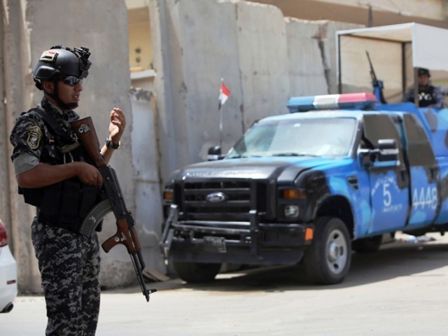 iraqi policeman at a checkpoint in the capital baghdad on june 12 2014