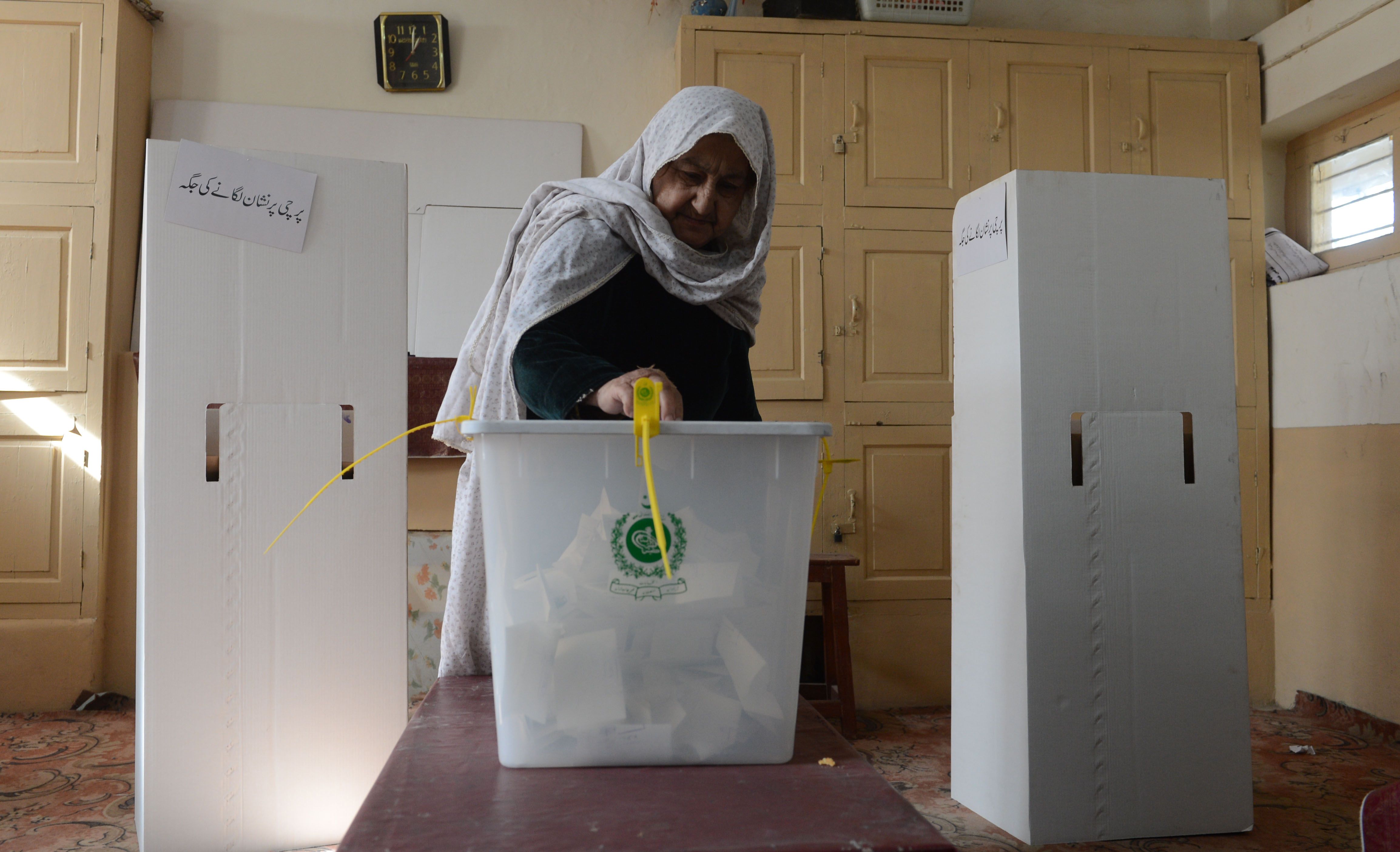 file photo of a woman casting her ballot for the local bodies elections in 2013 photo afp