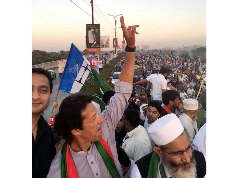 imran flashes the victory sign at a rally in karachi photo nni