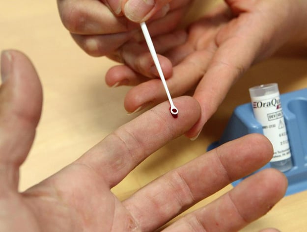 a nurse tests for hepatitis c at a hospital photo afp