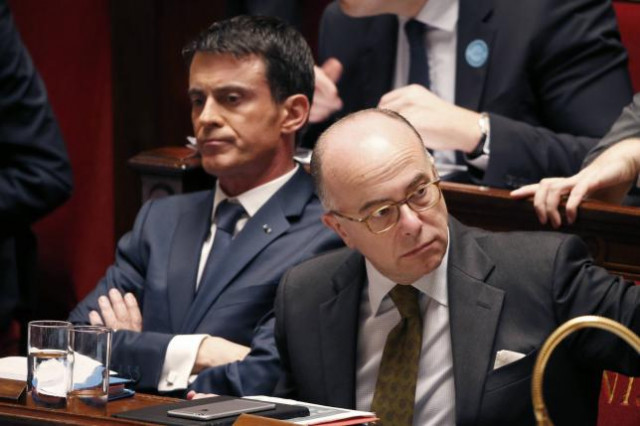 french prime minister manuel valls l and interior minister bernard cazeneuve attend a debate at the national assembly in paris france november 19 2015 photo reuters