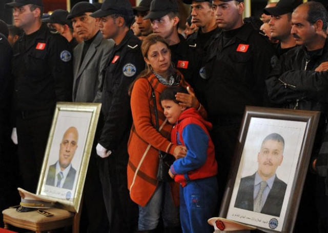 family members of the presidential guards who were killed in the bus bomb blast in tunis during an official ceremony to honour them on november 25 2015 photo afp family members of the presidential guards who were killed in the bus bomb blast in tunis during an official ceremony to honour them on november 25 2015 photo afp