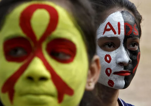 students wait for their face paint to dry before an aids awareness rally inside a school on the eve of world aids day in chandigarh india november 30 2015 photo reuters students wait for their face paint to dry before an aids awareness rally inside a school on the eve of world aids day in chandigarh india november 30 2015 photo reuters