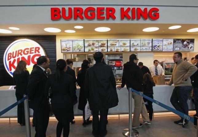 customers queue up on the opening day of the burger king restaurant at the marignane airport hall on december 22 2012 photo reuters