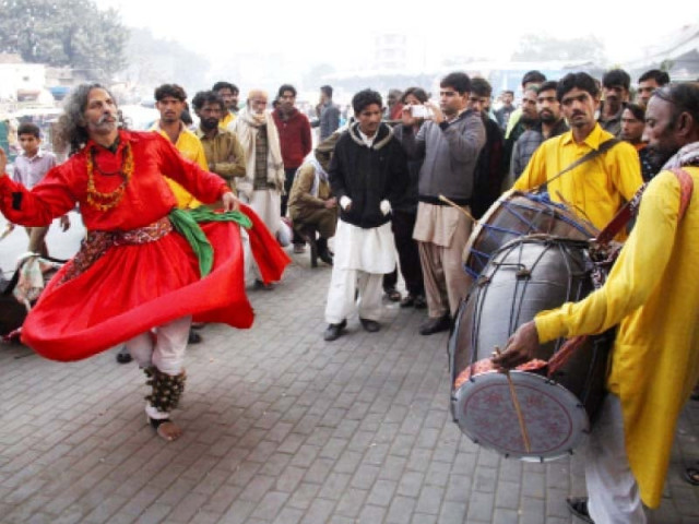 a devotee performing the dhamal at the data darbar ahead of the urs on monday photo abid nawaz express a devotee performing the dhamal at the data darbar ahead of the urs on monday photo abid nawaz express