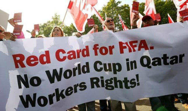 members of the swiss unia workers union display red cards and shout slogans during a protest in front of the headquarters of soccer 039 s international governing body fifa in zurich october 3 2013 photo reuters