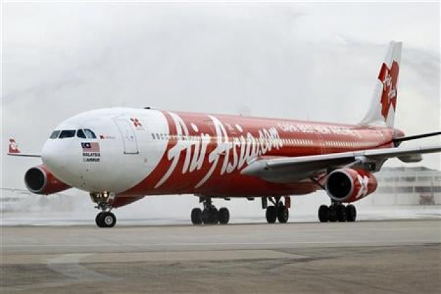 an airbus a340 airasia x passenger jet arrives on its inaugural flight photo reuters