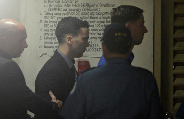 us marine private first class joseph scott pemberton c enters a court building to face the verdict of a murder case at the regional trial court in olongapo city on december 1 2015 photo afp