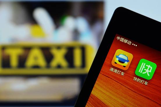 a smartphone shows the taxi hailing apps kuaidi dache and didi dache which merged to form didi kuaidi photo afp