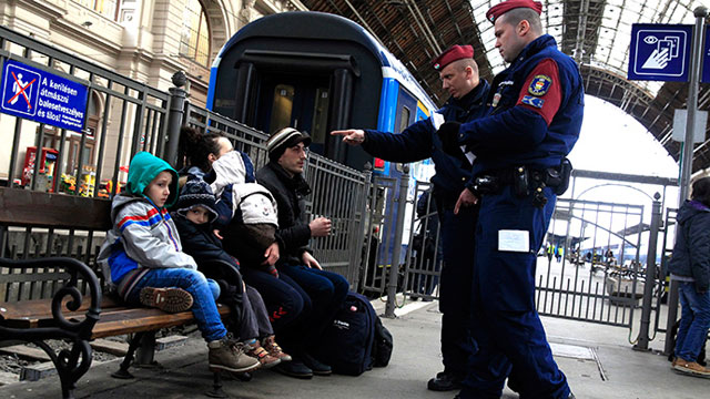 hungarian policemen check the documents of kosovars in keleti eastern railway station in budapest photo reuters