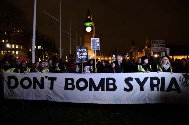 anti war protesters march in london on eve of syria strikes vote