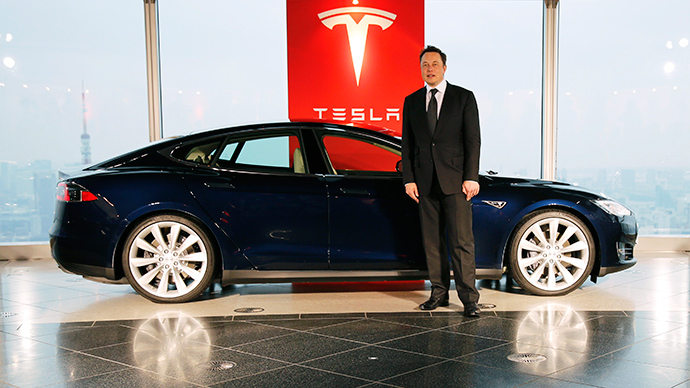 tesla motors inc chief executive elon musk poses with a tesla model s electric car photo reuters