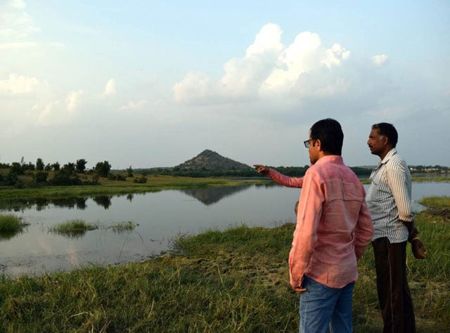 water activists and farmer gaju rawat look over lake nilona in yavatmal india photo trf stella paul water activists and farmer gaju rawat look over lake nilona in yavatmal india photo trf stella paul