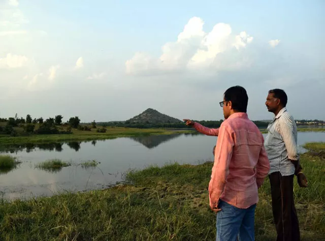 water activists and farmer gaju rawat look over lake nilona in yavatmal india photo trf stella paul water activists and farmer gaju rawat look over lake nilona in yavatmal india photo trf stella paul
