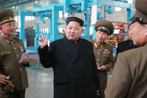 north korean leader kim jong un c inspects an industrial plant in a picture released by state news agency kcna on april 1 2015 photo afp