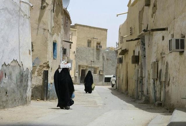 veiled women carry vegetables as they walk along a street at the neighbourhood of shmeisy in riyadh april 22 2013 photo reuters