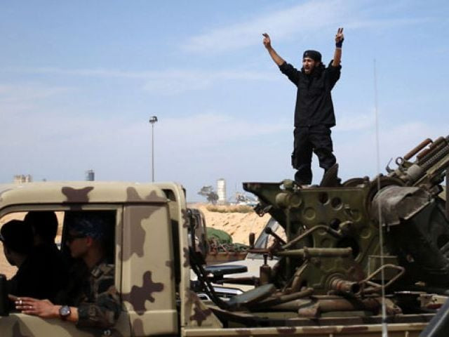 a fighter from misrata shouts to his comrades as they move to fight islamic state militants near sirte photo reuters a fighter from misrata shouts to his comrades as they move to fight islamic state militants near sirte photo reuters