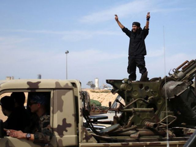 a fighter from misrata shouts to his comrades as they move to fight islamic state militants near sirte photo reuters