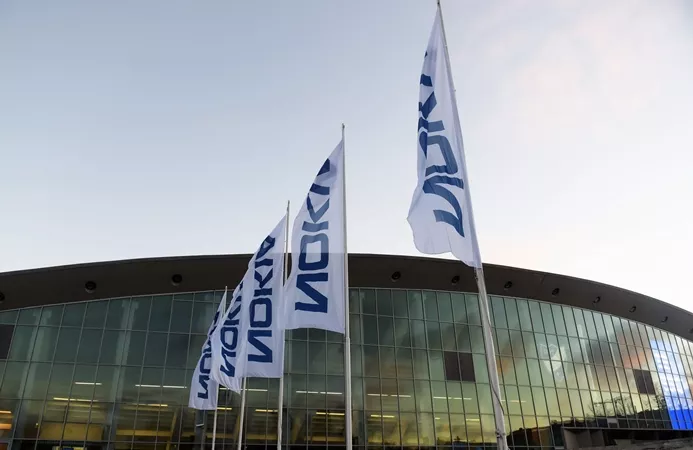 flags with the logo of finnish telecom group nokia flutter in front of the ice hall in helsinki where is being held an extraordinary general meeting of the group on december 2 2015 photo afp flags with the logo of finnish telecom group nokia flutter in front of the ice hall in helsinki where is being held an extraordinary general meeting of the group on december 2 2015 photo afp