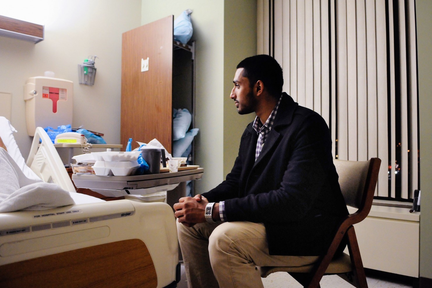 wasiullah mohamed executive director of the islamic center of pittsburgh sits friday with a taxi driver who was shot by a passenger last week the victim who asked not to be identified said he was shot in the back for being muslim photo post gazette