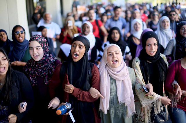 students chant while marching at a rally against anti muslim bias at san diego state university in san diego on november 23 2015 photo reuters